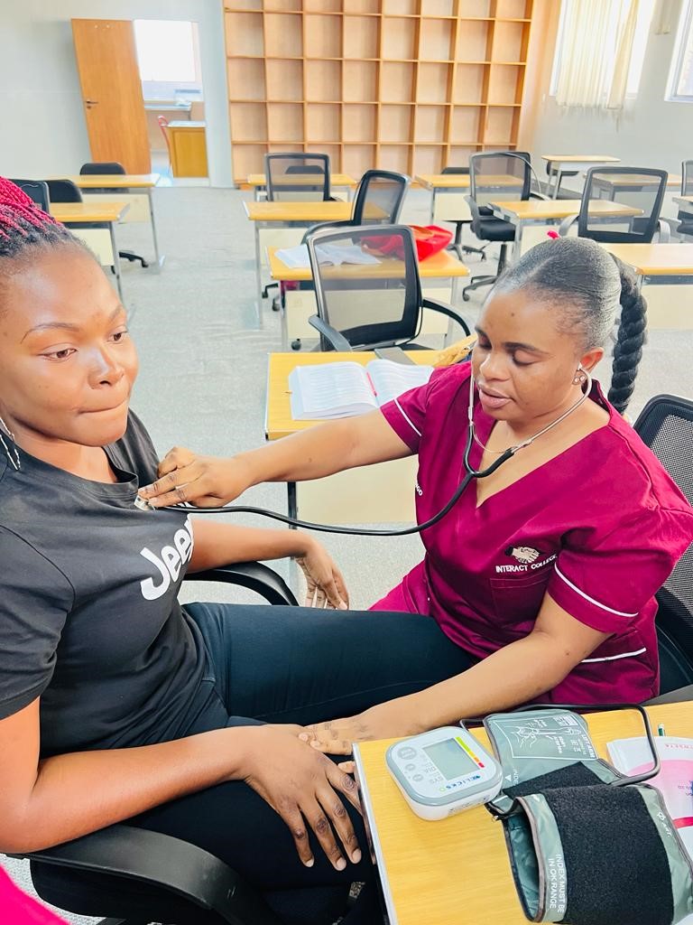 Health Promotion Officer Taking Blood Pressurer